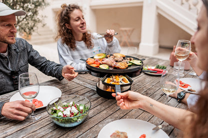 CIRCLE 35 Tabletop Grill Pro grilling with friends outdoors