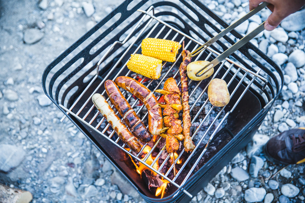 Corn and sausages cooking on the CUBE Cooking Grid